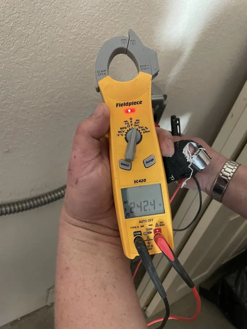 Voltage testing with clamp meter during Electrical Installation Services in Commerce City
